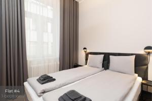 En eller flere senge i et værelse på Dandelion Apartments Elegance