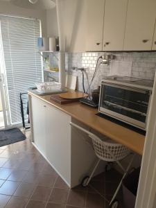a kitchen with a counter top with a microwave at Telperio - Guest suite max 4 Guests in Bunbury
