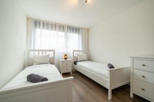 Postel nebo postele na pokoji v ubytování Swiss Suites - Menziken