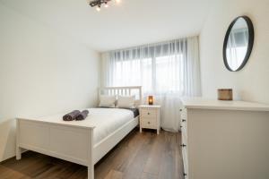 Postel nebo postele na pokoji v ubytování Swiss Suites - Menziken