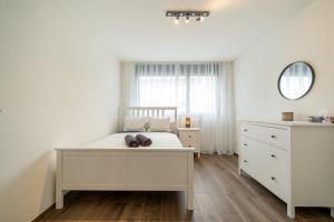 Postel nebo postele na pokoji v ubytování Swiss Suites - Menziken