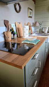 a kitchen with a counter with a wooden counter top at Amore in Chianti in Greve in Chianti
