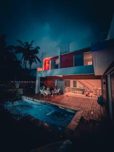 a house with a swimming pool in front of it at Elodie's Home Villa Contemporaine in Saint-Louis