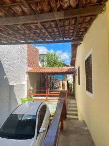 a car parked on a porch of a house at Aconchego em Gravatá in Gravatá +33 photos