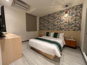 Uma cama ou camas num quarto em 墾丁卿卿文旅