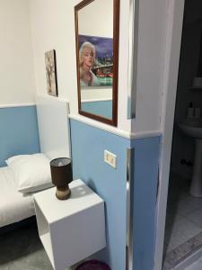 Postel nebo postele na pokoji v ubytování Hotel Alloggio Del Conte