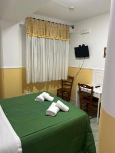TV a/nebo společenská místnost v ubytování Hotel Alloggio Del Conte