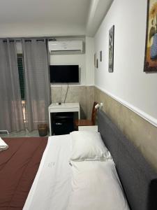 Postel nebo postele na pokoji v ubytování Hotel Alloggio Del Conte