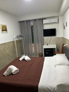 Postel nebo postele na pokoji v ubytování Hotel Alloggio Del Conte