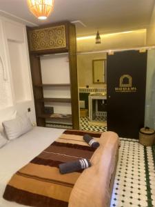 Postel nebo postele na pokoji v ubytování RIAD KS & SPA