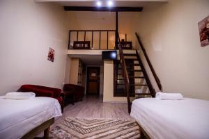 Vuode tai vuoteita majoituspaikassa Ruunawere Hotel