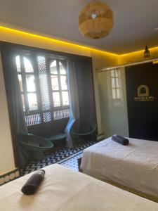 Postel nebo postele na pokoji v ubytování RIAD KS & SPA