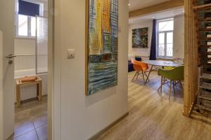 a room with a table and chairs and a painting on the wall at AD1716 apARTments Marktheidenfeld in Marktheidenfeld