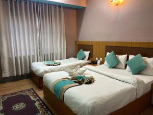 Ένα ή περισσότερα κρεβάτια σε δωμάτιο στο Hotel The President +7 φωτογραφίες