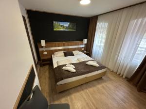 Posteľ alebo postele v izbe v ubytovaní Hotel-Landgasthof Katschtalerhof