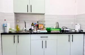 a kitchen counter with a lot of clutter on it at VaoVao Hotel in Nosy Be