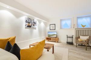 a living room with a couch and a chair at Ferienhaus Boy-Peter Keitum in Keitum