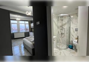 a bathroom with a shower and a bed in a room at Anka Boutique Hotel in Istanbul +23 photos