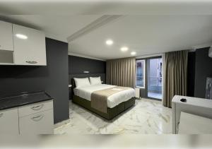 a hotel room with a bed and a kitchen at Anka Boutique Hotel in Istanbul