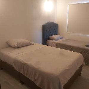 Postel nebo postele na pokoji v ubytování Villa Sami + 1 fotografie