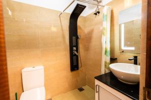 a bathroom with a phone on the wall next to a sink at Golden stars hotel Dambulla in Dambulla +29 photos