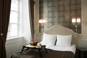 מיטה או מיטות בחדר ב-Phoenix Copenhagen