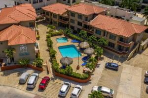 an aerial view of a house with a swimming pool at Palma Real 28 - 2-Bedroom Vacation Condo in Palm Beach, Aruba in Palm-Eagle Beach