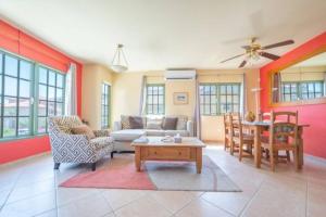 a living room with a couch and a table at Palma Real 28 - 2-Bedroom Vacation Condo in Palm Beach, Aruba in Palm-Eagle Beach