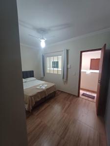 A bed or beds in a room at Pousada Estrela Mares Suíte 204