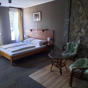 Postel nebo postele na pokoji v ubytování Villa Sagan