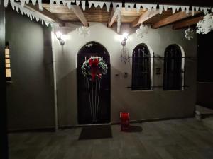 a room with a door with a wreath on it at Casa Di Munti in Konitsa