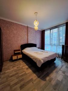 Rúm í herbergi á Karvi Hostel & Suites