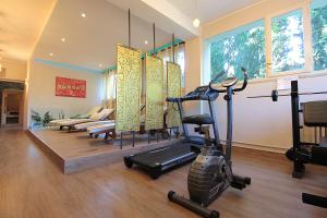 a room with a gym with a treadmill at Catullo 18 Apartment, Lago Di Garda, Jacuzzi in Desenzano del Garda