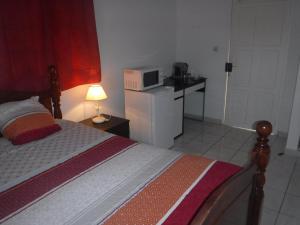 Una cama o camas en una habitación de MANIKOU