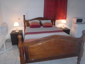 Una cama o camas en una habitación de MANIKOU