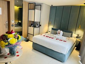 Postel nebo postele na pokoji v ubytování Deep Blu Boutique Hotel