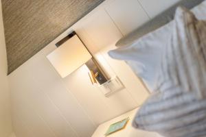 Postel nebo postele na pokoji v ubytování Inselliebe Exklusive Sylter Wellnessoase mit Sauna Garten in Keitum