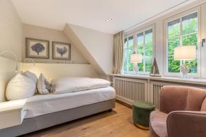 Postel nebo postele na pokoji v ubytování Inselliebe Exklusive Sylter Wellnessoase mit Sauna Garten in Keitum