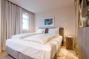 Postel nebo postele na pokoji v ubytování NEU! HAFEN27, No 9 - Traumurlaub mit Wattblick in List - Sylt