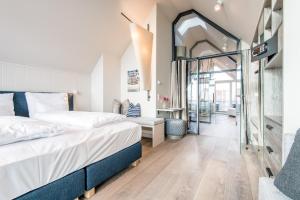 Un pat sau paturi într-o cameră la NEU! HAFEN27, No 10 - exklusiv urlauben mit Wattblick in List auf Sylt