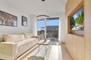 Posezení v ubytování Modern Apt with AC and Balcony + 6 fotografií