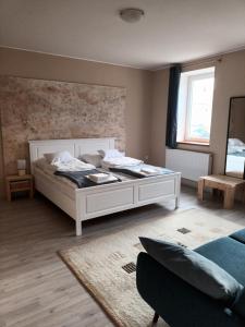 Postel nebo postele na pokoji v ubytování Corner Apartman
