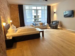 a bedroom with a bed and a living room at cinderella.kreuzberg in Berlin