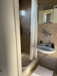 a bathroom with a sink and a shower at Villa L.L in Splitska +40 photos