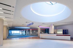 a lobby of a building with a large ceiling at Clarion Congress Hotel Olomouc in Olomouc