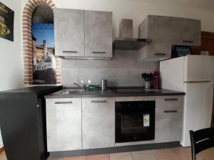 Kuchyňa alebo kuchynka v ubytovaní La Casa dei Bersaglieri