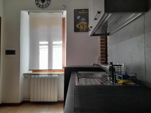 Kuchyňa alebo kuchynka v ubytovaní La Casa dei Bersaglieri