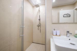 a bathroom with a shower and a sink at Vienna City Center Hostel in Vienna