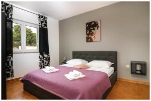 Postel nebo postele na pokoji v ubytování M&Z Apartmani