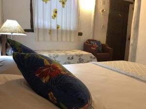 Postel nebo postele na pokoji v ubytování Hospedagem Estalagem Paraty para temporada